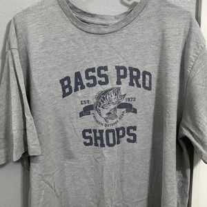 90% cotton 10% polyester- mens XL grey and navy blue bass pro shop t-shirt